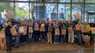 WSFS Associates gather with employees from the Sunday Breakfast Mission to kick off the annual Food Drive.