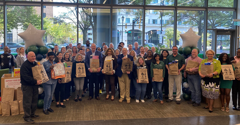 WSFS Associates gather with employees from the Sunday Breakfast Mission to kick off the annual Food Drive.