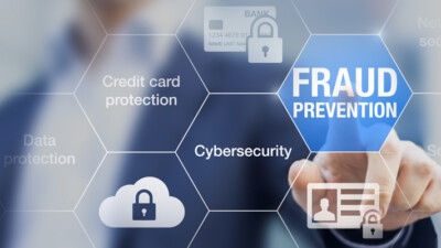 A hand pointing at graphics that say fraud prevention, cybersecurity, credit card protection and data protection.