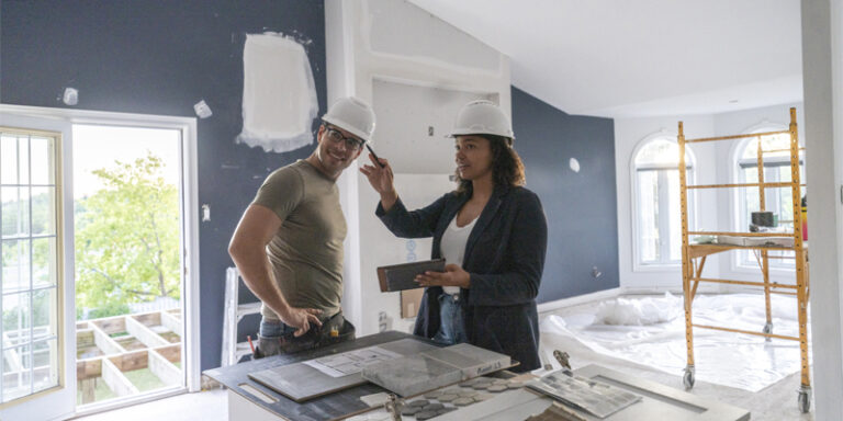 A contractor reviewing renovation plans with the homeowner.