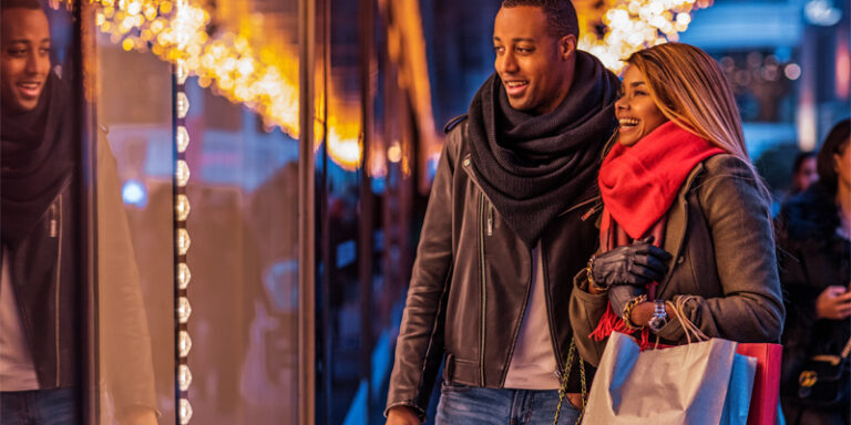 A man and a woman window shopping.