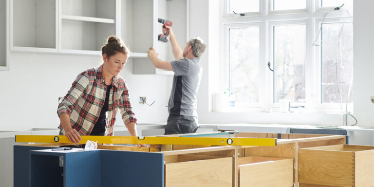 Man and woman doing home renovation work.