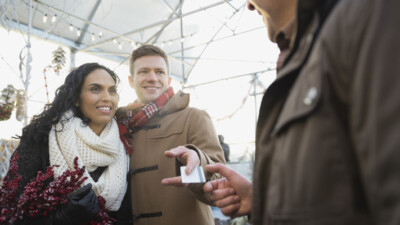 A couple paying with a credit card.