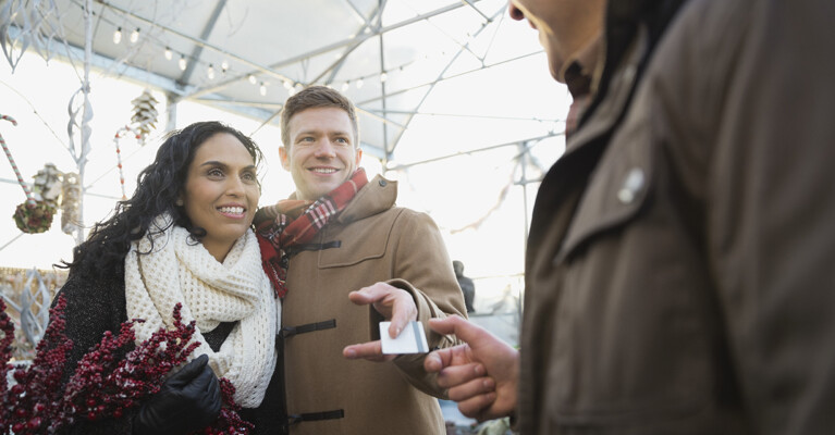 A couple paying with a credit card.