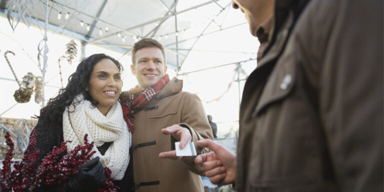 A couple paying with a credit card.