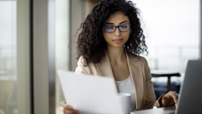 Woman looking at paperwork.