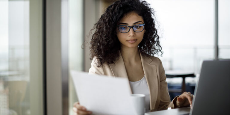 Woman looking at paperwork.