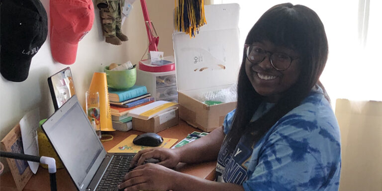 A WSFS Intern using the computer.