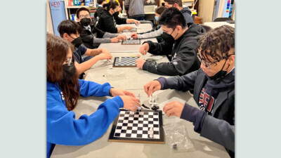 Young people playing chess.