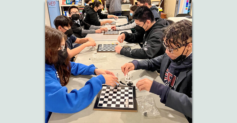 Young people playing chess.