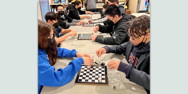 Young people playing chess.