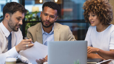 A couple discussing loan options with their banker.