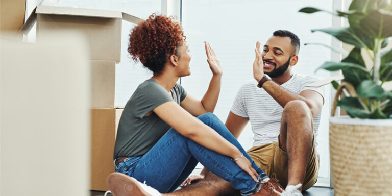 New homeowners amongst moving boxes.