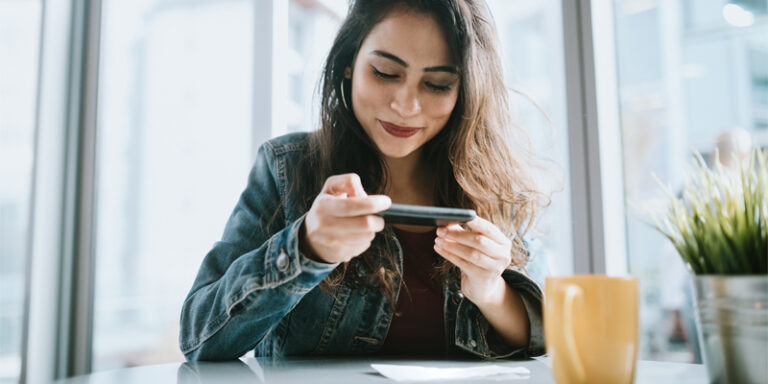 Woman scanning a check using her phone.