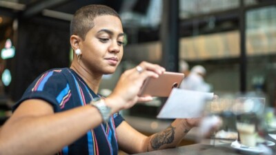 Woman scanning a check using her phone.