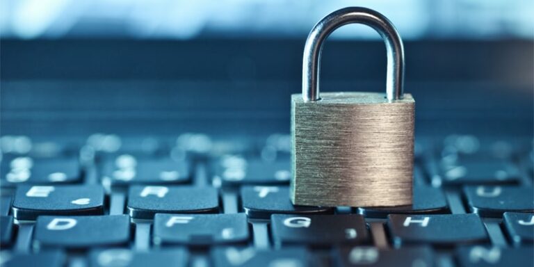 Padlock resting on a keyboard.