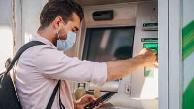 Man using an ATM.