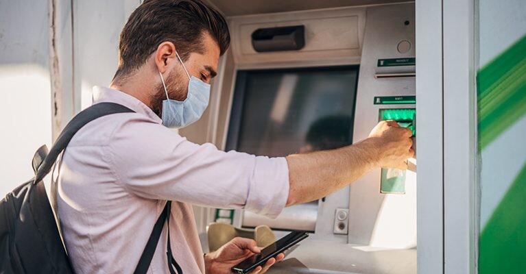 Man using an ATM.