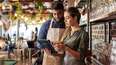 Small business owners discussing the business’ finances.