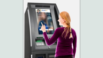 Woman using CashConnect kiosk.