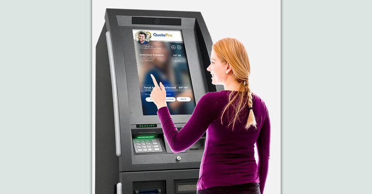 Woman using CashConnect kiosk.