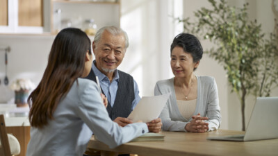 A couple discussing finances with their adviser.