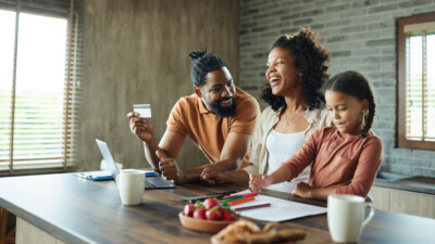 A family reviewing their finances together.