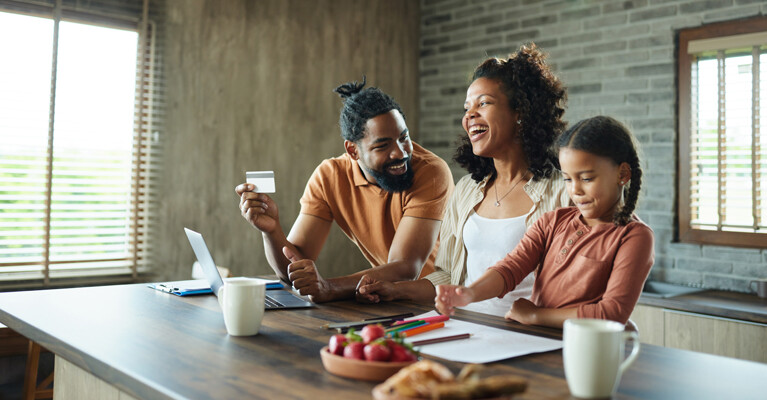 A family reviewing their finances together.