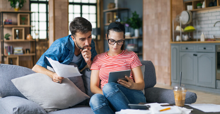 A couple reviewing their budget and finances for the new year.