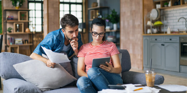 A couple reviewing their budget and finances for the new year.