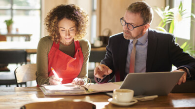 A small business owner working with their banker.