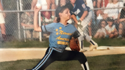 A young boy throwing a baseball.