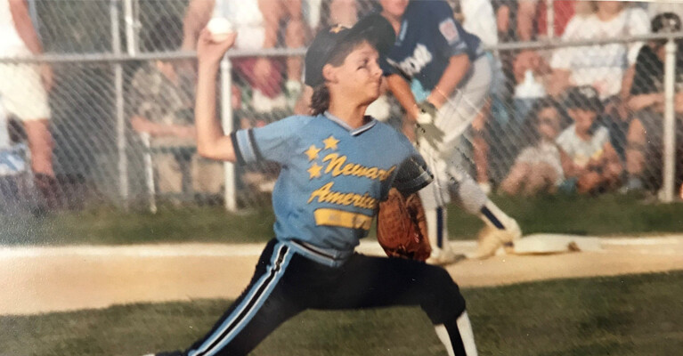 A young boy throwing a baseball.