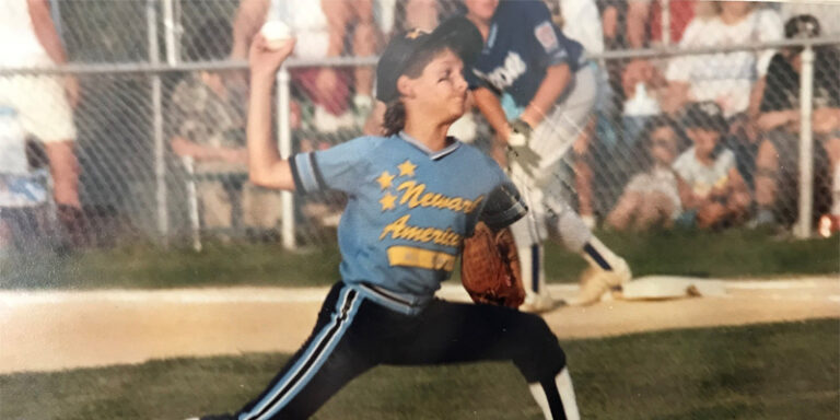 A young boy throwing a baseball.