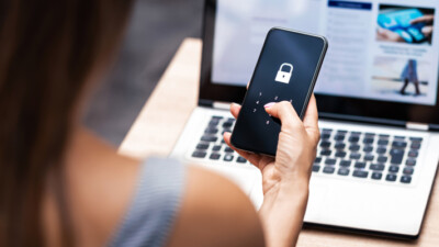 A woman unlocking her cell phone.