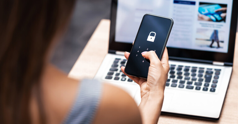 A woman unlocking her cell phone.