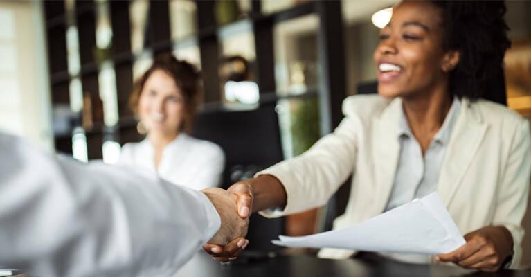 Businesspeople shaking hands.