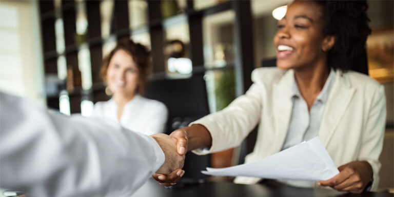 Businesspeople shaking hands.