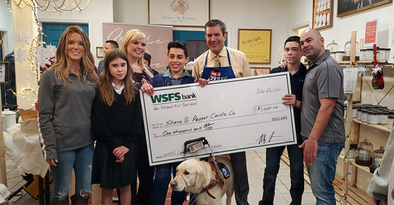 WSFS Associates with a $1000 check for the Shane & Pepper Candle Company.