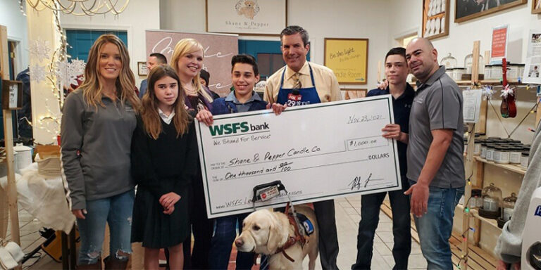WSFS Associates with a $1000 check for the Shane & Pepper Candle Company.