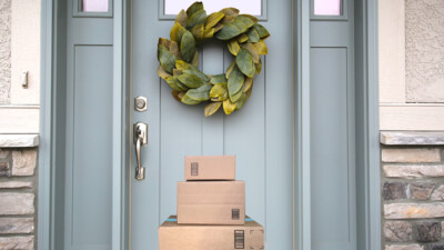 A stack of packages in front of a door.