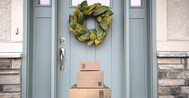 A stack of packages in front of a door.