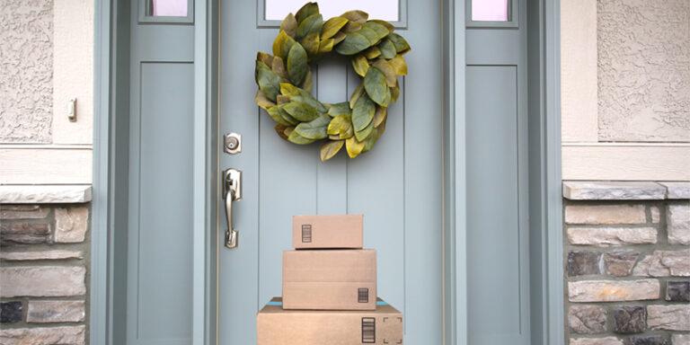 A stack of packages in front of a door.