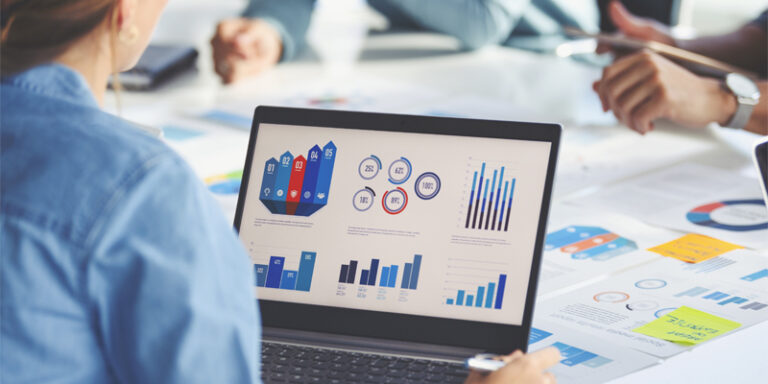 A laptop screen displaying charts and graphs.