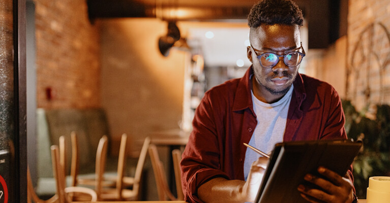 A small business owner reviewing the business’ expenses.