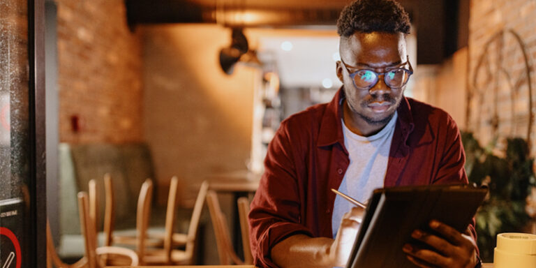 A small business owner reviewing the business’ expenses.