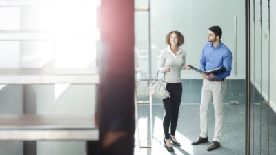 A real estate agent showing a woman a property.