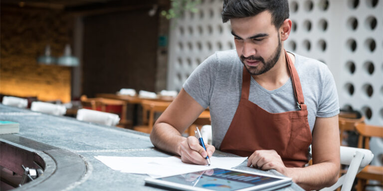 A small business owner reviewing expenses.
