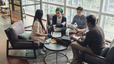 A group of small business employees working with their business partners.