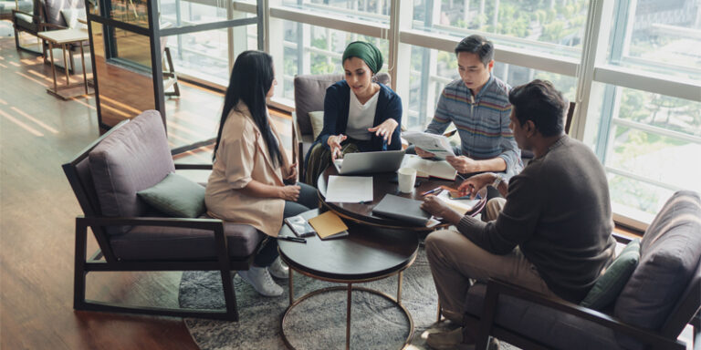 A group of small business employees working with their business partners.
